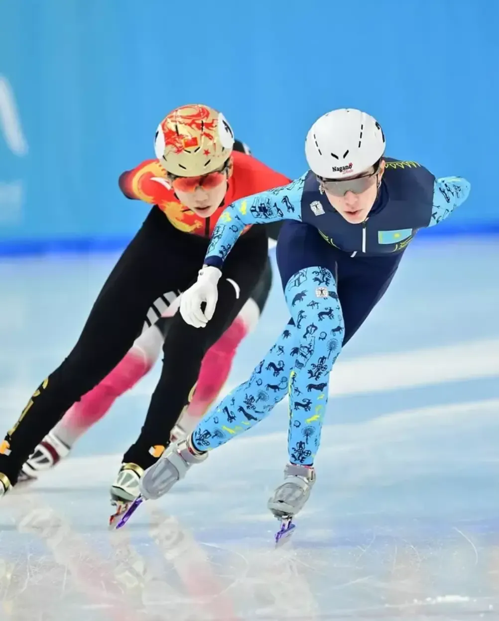 Short track skaters racing on ice